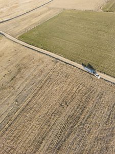 Aerial shot of farmland in Turkey showing expansive fields and rural roads.